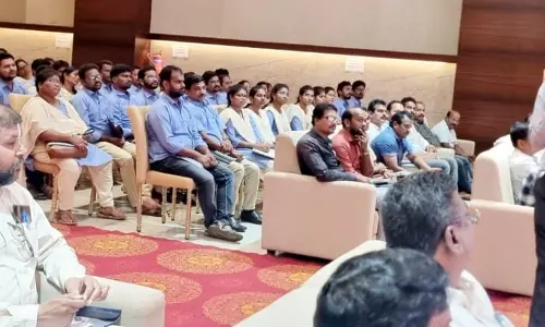 Commissioner and DMA, P.Koteswara Rao explaining about lands re-survey in urban areas to officials and staff at Srikakulam on Friday.