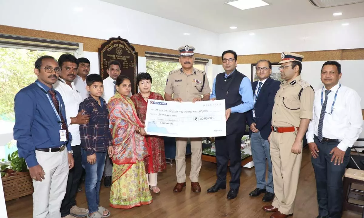 DGP presents `30L cheque to wife of deceased home guard