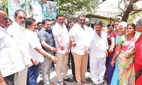 Mayor Kavati Siva Naga Manohar Naidu and MLA Maddali Giridhara Rao laying foundation stone for the construction of roads in Guntur on Friday