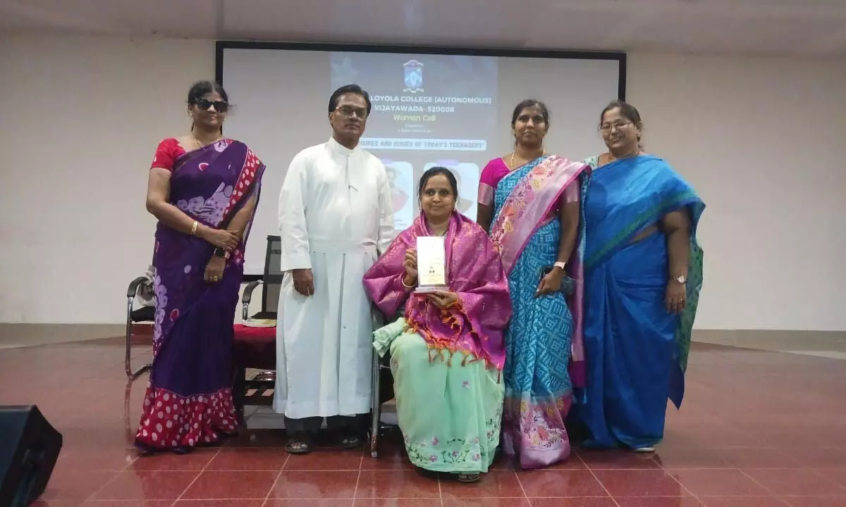 Intermediate Vice-Principal Rev Fr S Raju and women’s cell members of Andhra Loyola College felicitating B Pushpa Kumari, advocate in High Court in Vijayawada on Monday