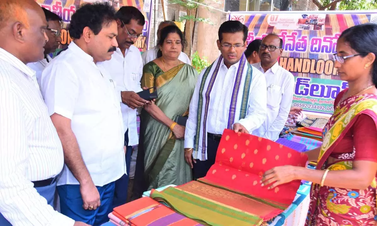 Prakasam district Collector AS Dinesh Kumar inspecting handloom clothes at the exhibition organised at the Collectorate in Ongole on Monday