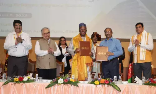 High Commissioner of Gambia Mustapha Jawara and SRM-AP Registrar of Prem Kumar exchanging Memorandum of Understanding at the University in Neerukonda on Saturday. AP State Council of Higher Education chairman Prof Hemachandra Reddy, Vice-Chancellor Prof Manoj K Arora and AP State Information Commissioner P Samuel Jonathan also seen.