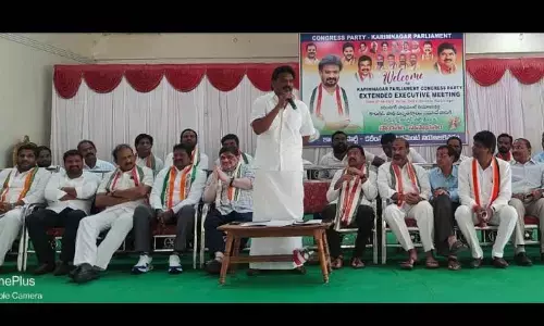 AICC secretary Christopher Tilak speaking at a Congress party meeting in Karimnagar on Monday