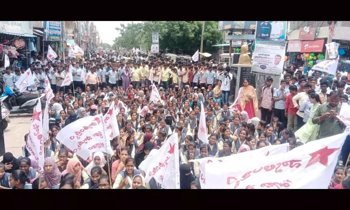 SFI district unit members taking out a rally in Guntakal on Tuesday