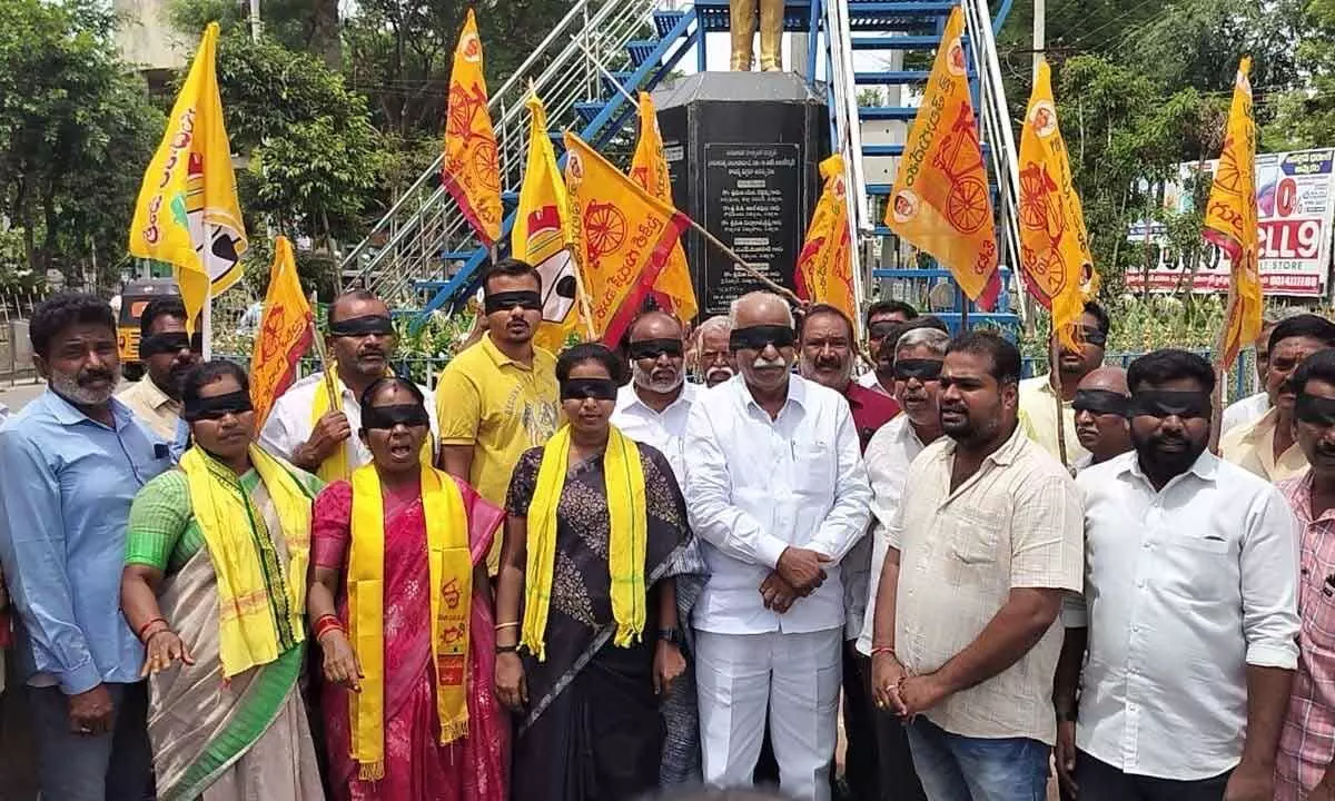 TDP leaders staging a protest with their eyes covered with black ribbon at Ambedkar statue in Chittoor on Tuesday