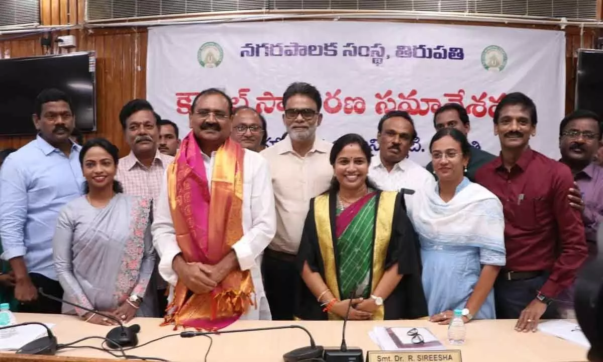 Corporation officials felicitating city MLA Bhumana Karunakar Reddy over his appointment as TTD chairman, at the municipal council meeting in Tirupati on Tuesday