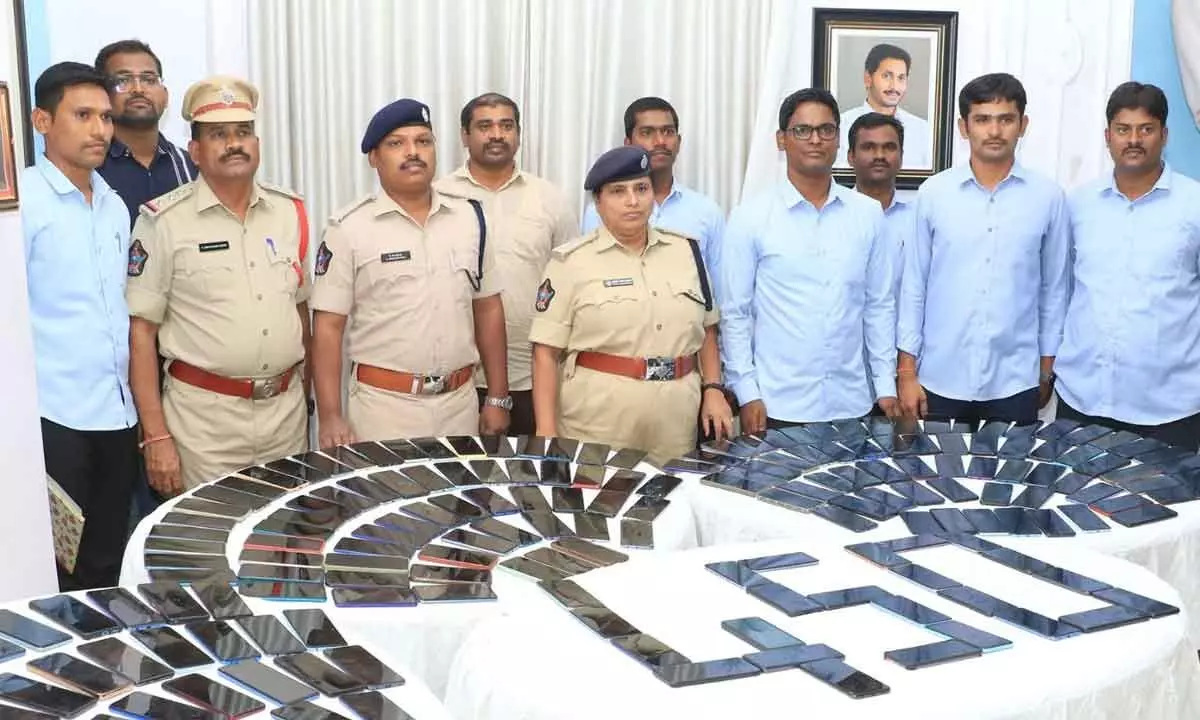 Police officials show the recovered mobiles to the media in Tirupati on Tuesday