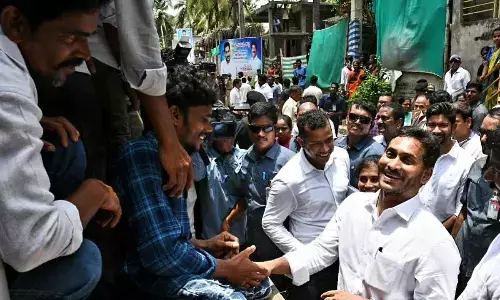 Chief Minister Y S Jagan Mohan Reddy interacting with the flood victims in Mummidivaram mandal in Dr B R Ambedkar Konaseema district on Tuesday