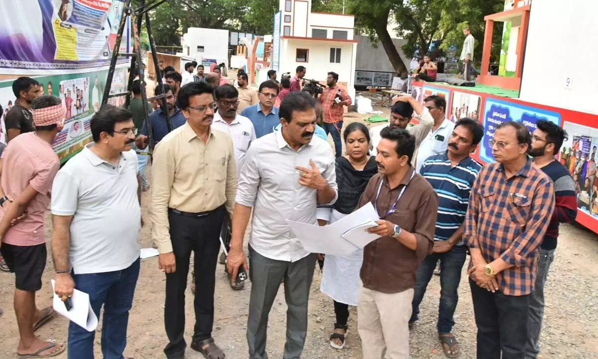 I&PR Commissioner Dr Tumma Vijaykumar Reddy reviewing the tableaus of various departments at Indira Gandhi Municipal Corporation stadium in Vijayawada on Sunday