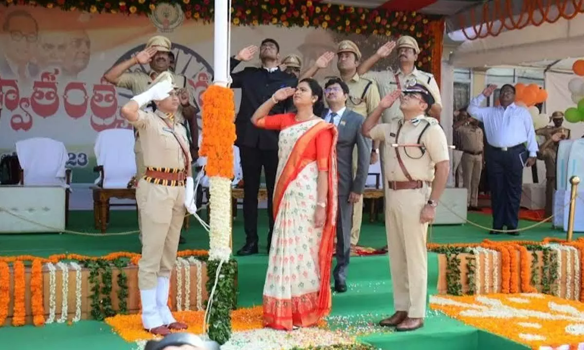 District in-charge and Health Minister V Rajini along with others saluting the national flag at Police Barracks Grounds in Visakhapatnam on Tuesday