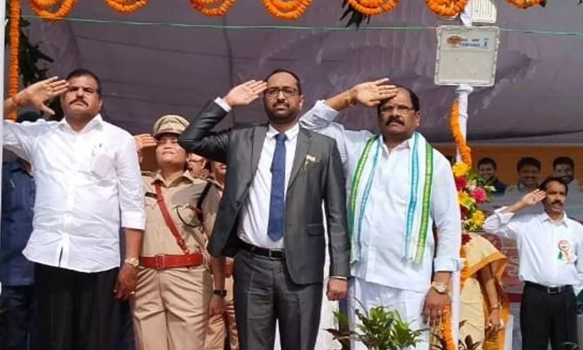 District in-charge minister Botcha Satyannarayana (left) saluting the national flag after unfurling it on the occasion of Independence Day in Srikakulam on Tuesday