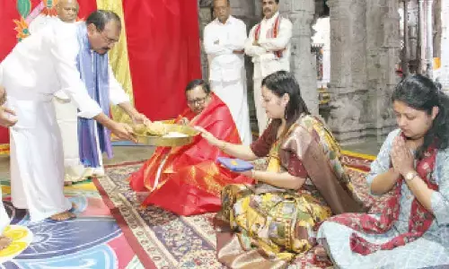 TTD chairman B Karunakar Reddy presenting theerta prasadams to Supreme Court Judge Justice Ujjal Bhuyan who had a darshan of Lord on Monday in Tirumala.