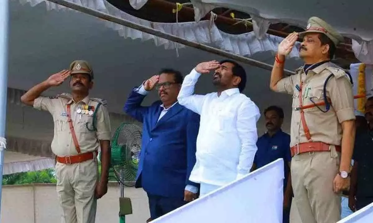 Minister Jagadish Reddy along with District Collector Venktat Rao and SP Rajendra Prasad saluting to the national flag in Suryapet on Tuesday
