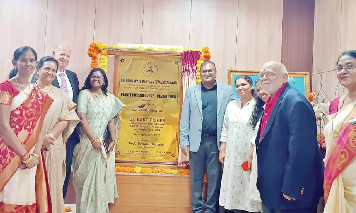 Dr Bart Fisher along with SPMVV V-C Prof D Bharathi, registrar Prof N Rajani, Prof D M Mamatha and others at the Climate Hub plaque in SPMVV on Tuesday