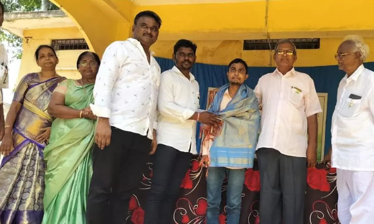 Abdul Eesub, who secured free seat for admission into 4-yr B Tech course at VIT-AP University being felicitated at Akunuru Government Junior College in Krishna district on Tuesday. He stood first in the district by securing 960 marks in the Intermediate examination