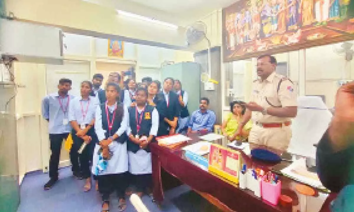 RPF CI K Madhusudhan explaining video surveillance system to students at Tirupati railway station on Wednesday