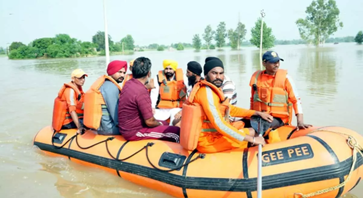 Riding boat, Punjab CM visits flood-hit areas