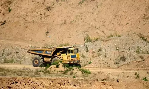 A truck transporting sand from Penna river