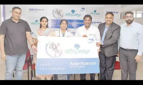 Management of Aster Ramesh Hospital launching Arogya Bhagyam card in Ongole on Wednesday