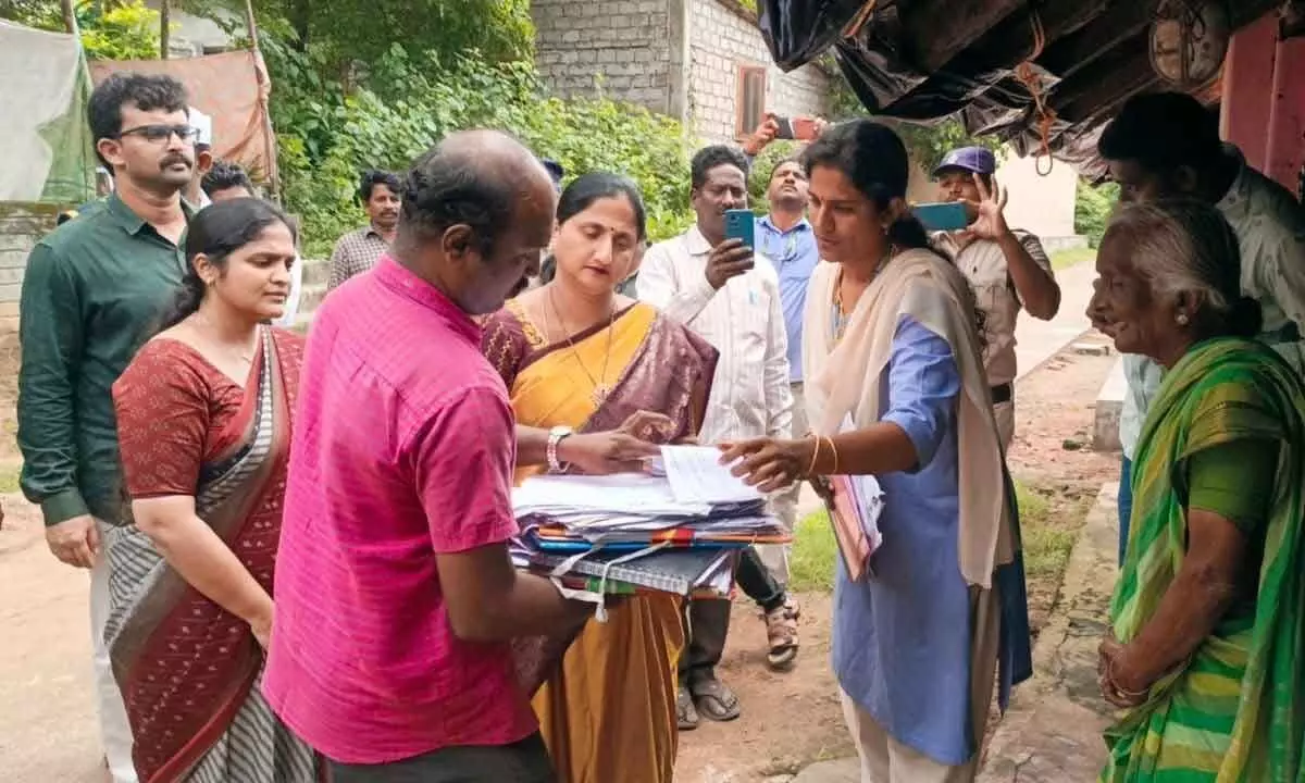 Collector Dr K Madhavi Latha inspecting the voter survey in  Pallakadiyam village in Rajanagaram constituency in  East Godavari district on Saturday