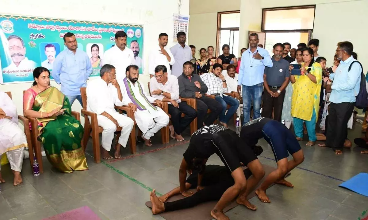 Students performing Yogasanas on the occasion of district-level selection competitions organised at outdoor stadium in Kurnool on Sunday