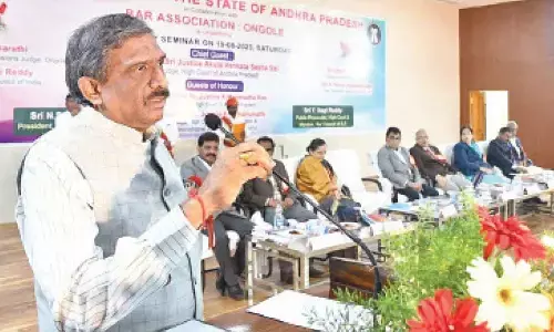 AP High Court Judge Justice A V Seshasai speaking at a seminar jointly organised by the AP Bar Association, Indira Priyadarsini Law College and the Ongole Bar Association in Ongole on Saturday