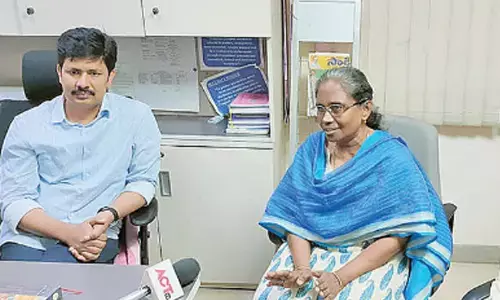 MP Dr M Gurumoorthy with Passport Seva Kendra officials in Tirupati on Monday.