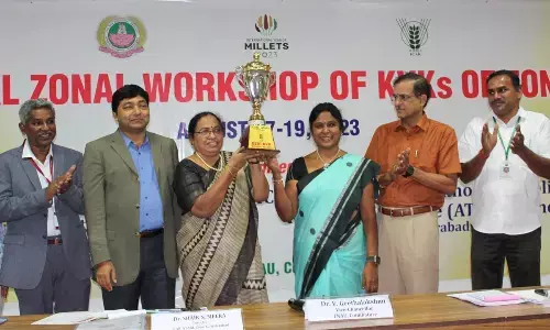 Senior Scientist and Head of KVK Yagantipalle, G Dhanalakshmi,  receiving trophy from the hands of Dr V Geetha Lakshmi, the Vice-Chancellor of Tamil Nadu Agriculture University, in Coimbatore