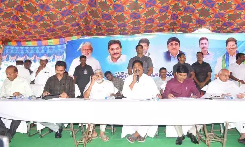 Palnadu district In-charge Minister Karumuri Venkata Nageswara Rao addressing the meeting in Sattenapalli on Tuesday. Minister for Water Resources Ambati Rambabu is also seen