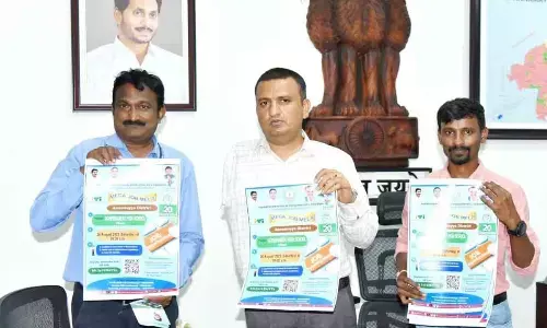 District Collector PS Girisha unveiling poster on Mega job mela at his chamber in Rayachoti on Tuesday