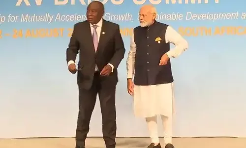 At BRICS meeting, PM Modi picks up tricolour placed as marker on stage, keeps it with him