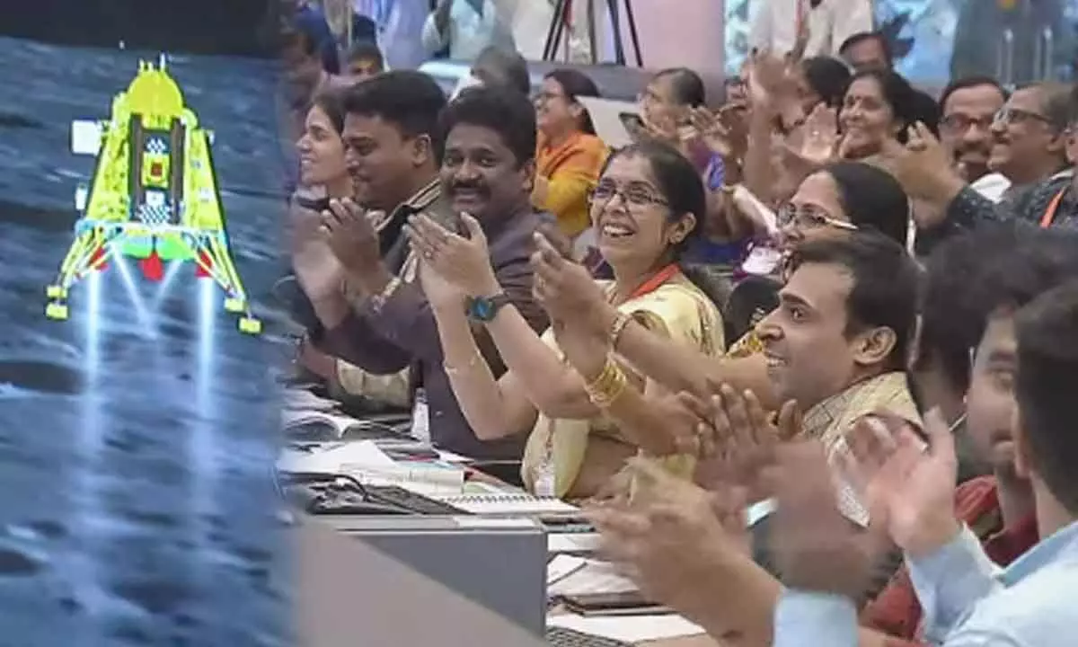 Scientists celebrate at the control room of ISRO headquarters after the Chandrayaan-3s Lander Module, comprising the lander (Vikram) and the rover (Pragyan), successfully touches down on the Moons surface, on Wednesday