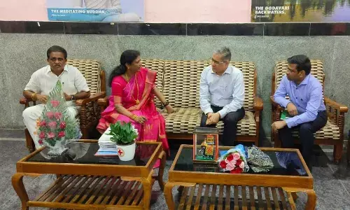 MP Vanga Geetha discussing rail development-related issues with DRM Narendra A Patil at VIP lounge in Kakinada railway station on Wednesday