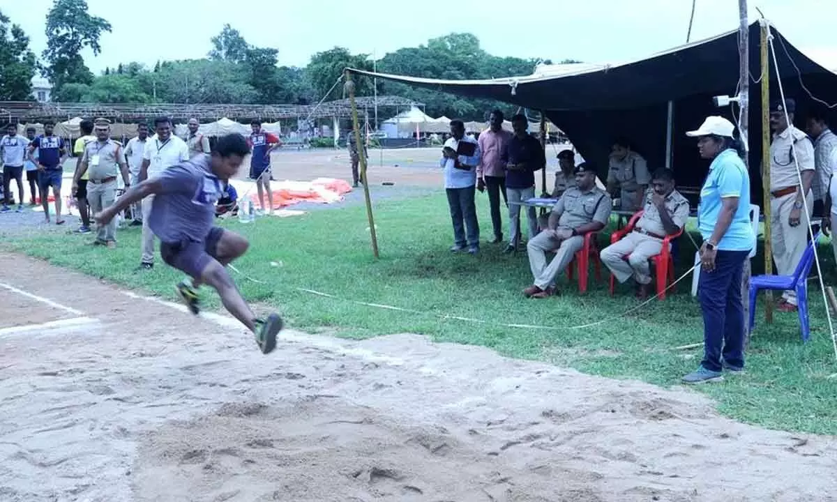 Guntur range IG G Pala Raju and District SP K Arif Hafeez inspecting the SI candidates taking part in the long jump test at the Police Parade Grounds in Guntur on Saturday