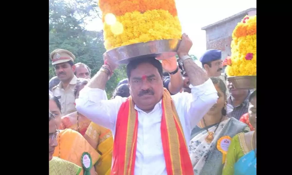 Minister for Panchayat Raj and Rural Development Errabelli Dayakar Rao carry out Bathukamma as part of Bonam celebrations at TSK Thanda in Palakurthi constituency on Sunday