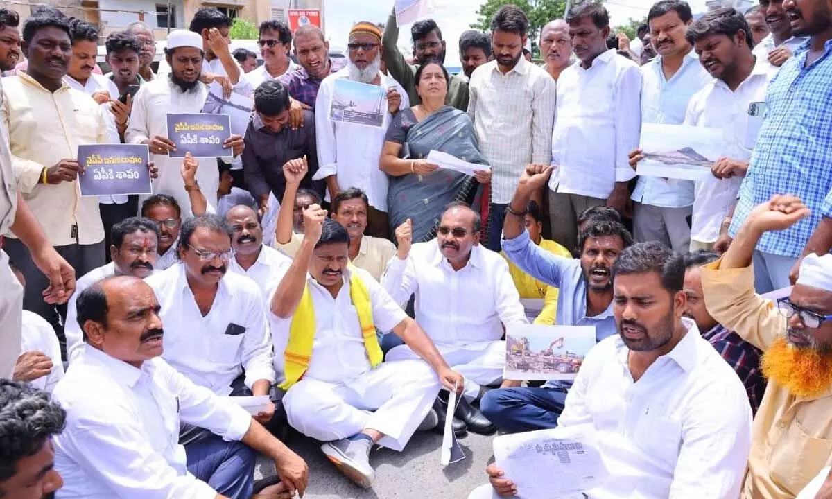Former Minister and TDP politburo member Prattipati Pulla Rao,  former MLA Kommalapati Sridhar and party leaders staging a protest at Ambedkar statue in Amaravati on Monday