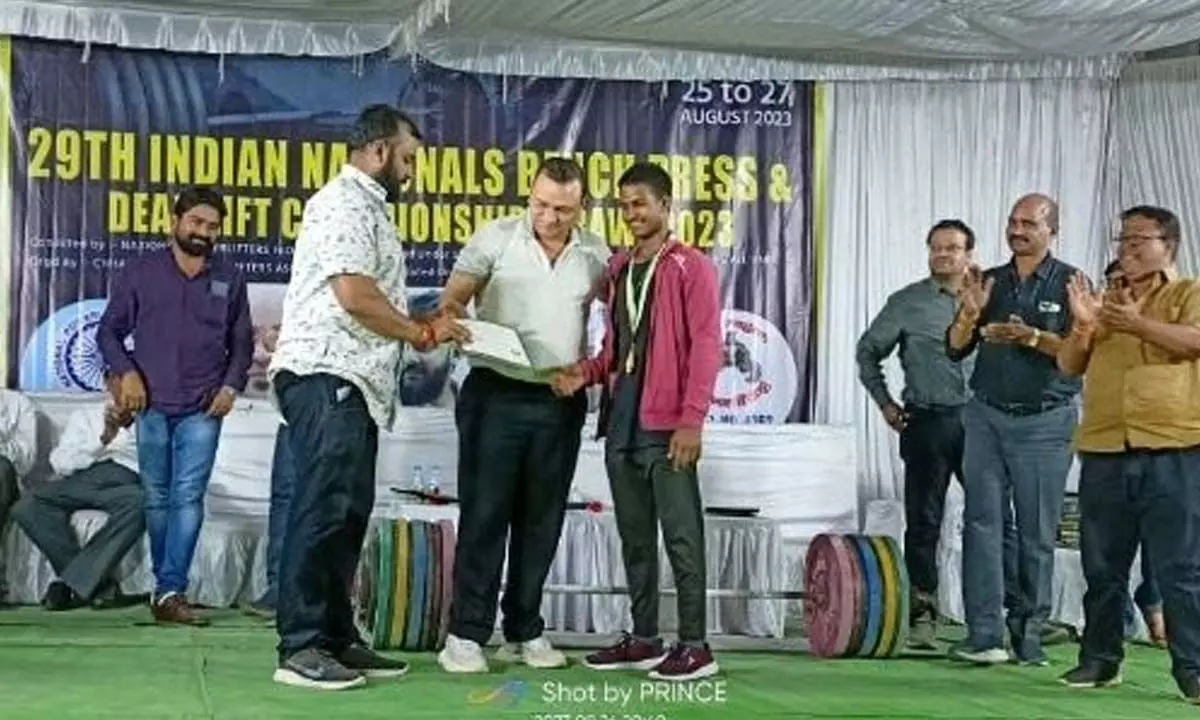 Madhu Teja being presented with gold medal in Chhattisgarh after winning first place in powerlifting sub-junior competitions