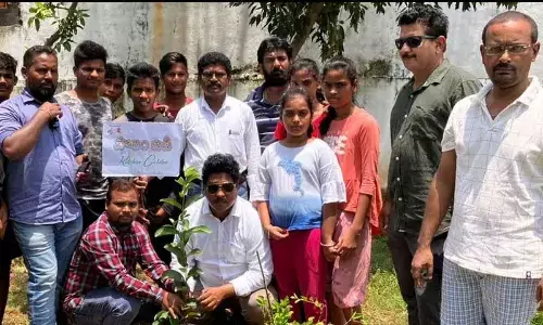 JD Foundation and Green Army representatives plating saplings at BC hostel at Kasibugga in Srikakulam on Sunday