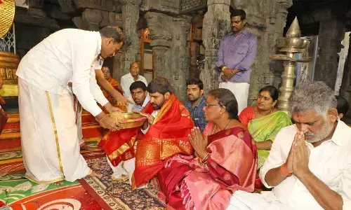 TTD JEO Veerabrahmam offering Srivari Prasadam to TUDA Chairman C Mohit Reddy after  the latter took oath as ex-officio member of the TTD Trust Board on Sunday