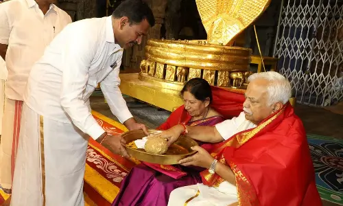 TTD JEO Veerabrahmam presenting Theertha Prasadams to Raghunath Viswanath Deshpande from Karnataka after took oath as TTD Trust Board member in Tirumala on Monday