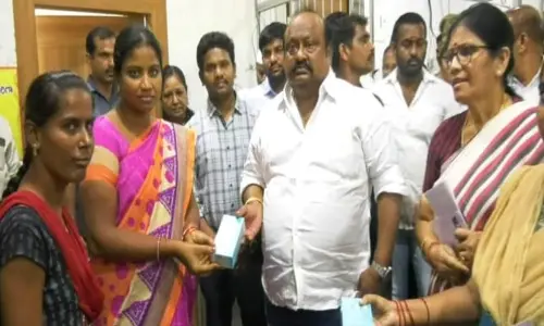 Karimnagar: Gangula distributes cell phones to disabled persons