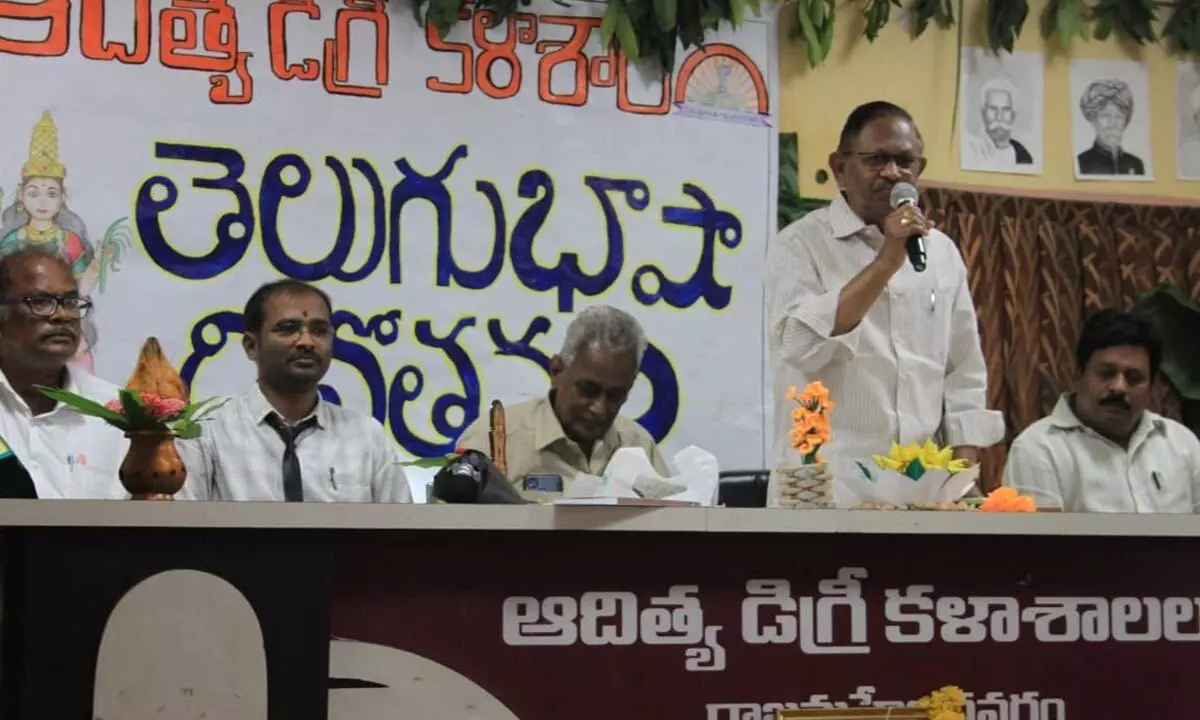 Retired Magistrate SR Prithvi addressing the ‘Telugu Language Day’ programme in  Rajamahendravaram on Tuesday. Director of Aditya Educational Institutions SP Gangi Reddy and Principal Ch Phani Kumar are also seen