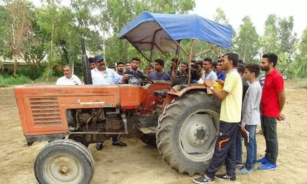 Students at Northern Region Farm Machinery Training & Testing Institute in Garladinne mandal