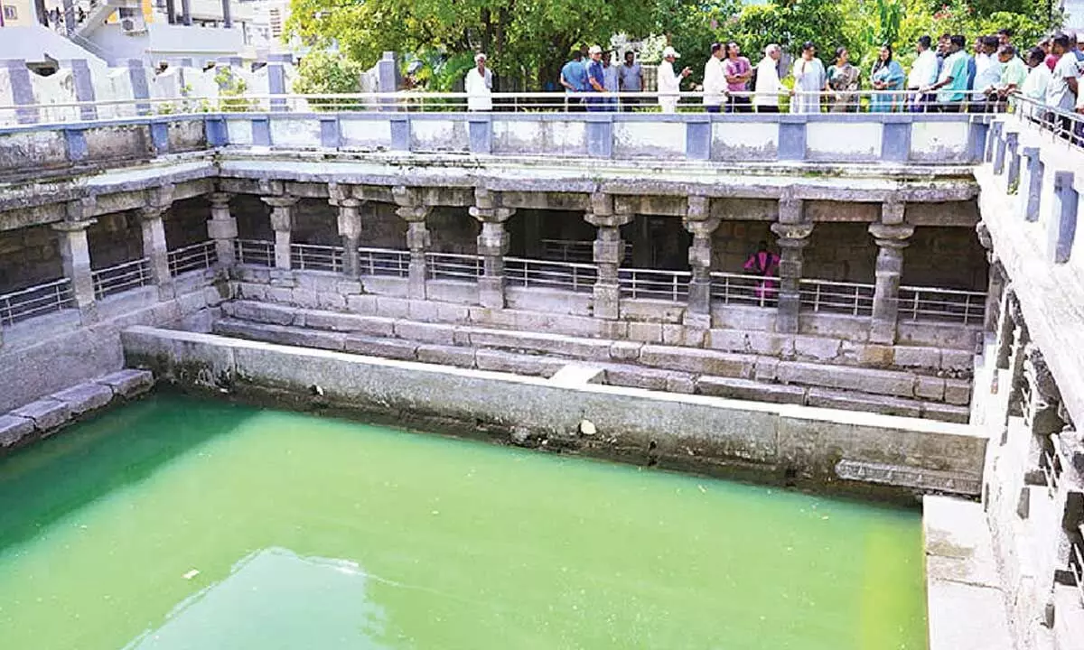 Warangal district collector P Pravinya, along with Mayor Gundu Sudharani and conservation architect Kalpana Ramesh insecting the stepwell in Warangal on Tuesday