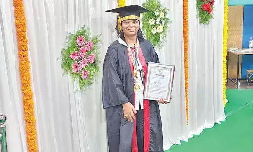M Roja with her gold medals