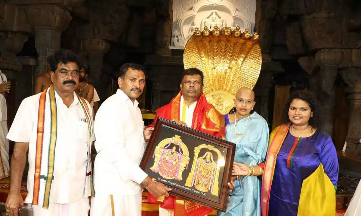 TTD JEO Veerabrahmam presenting laminated photo of Lord to Endowments Special Chief Secretary Karikala Valaven after his oath-taking as TTD Trust Board member in Tirumala on Wednesdays