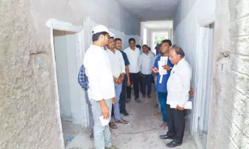 District Collector VP Gautham inspecting double bed houses construction works in Khammam on Wednesday.