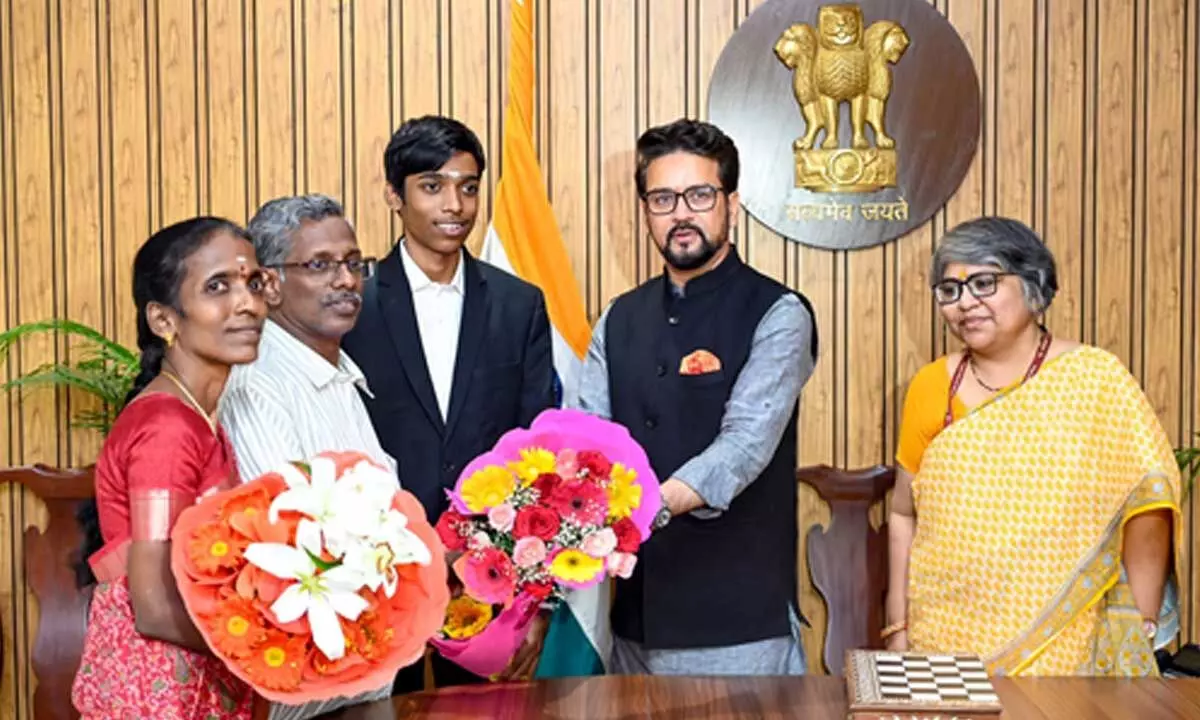 Sports Minister Anurag Thakur honours chess GM R. Praggnanandhaa and his parents