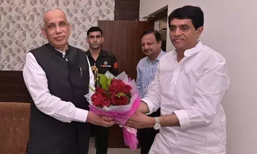 Finance Minister Buggana Rajendranath Reddy receiving Governor S Abdul Nazeer in Kurnool on Thursday