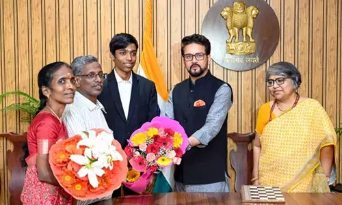 Sports Minister Anurag Thakur honours chess GM R. Praggnanandhaa and his parents